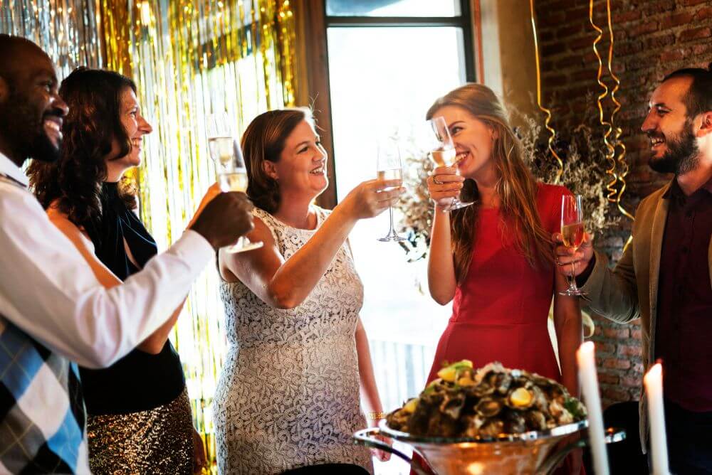 Group of people celebrating an occasion with wine - Walter’s BBQ Southern Kitchen