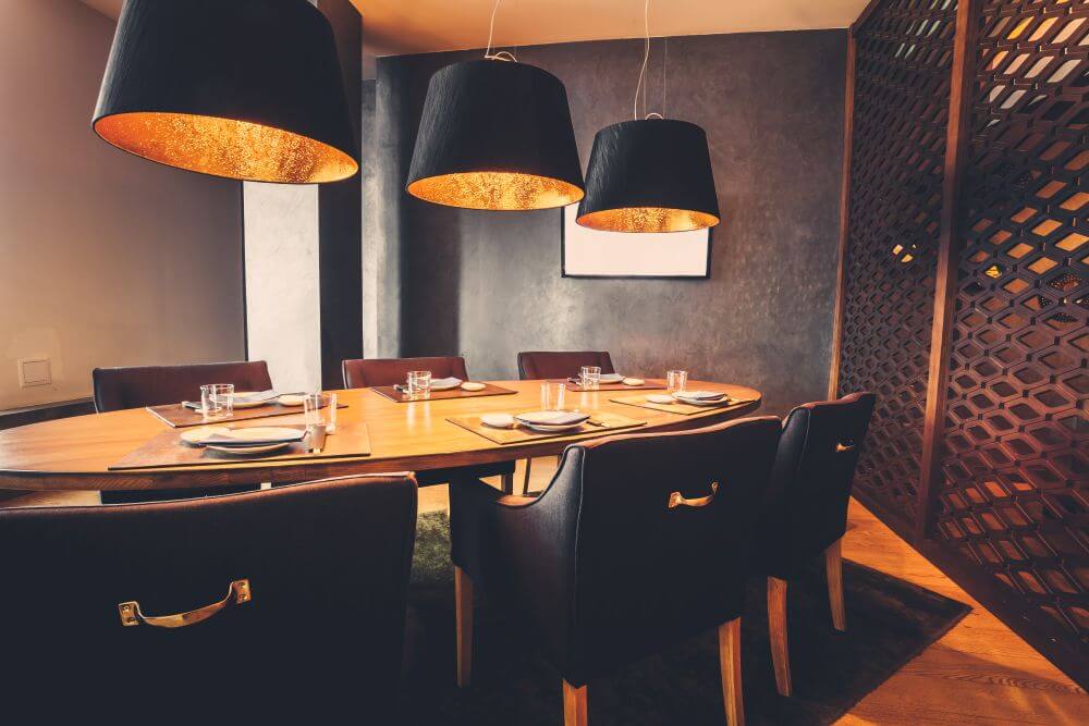 Private room in a restaurant with wood interior and leather chairs-  Walter’s BBQ Southern Kitchen